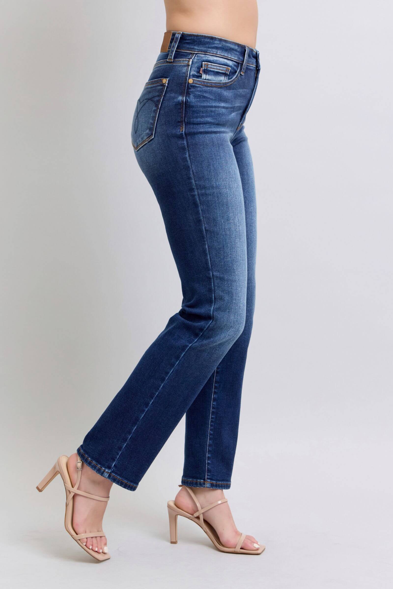 Judy Blue washed straight leg jeans with pockets, stylishly paired with heels for a trendy everyday look.