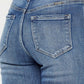 Close-up of back pocket and high waist design of Cat's Whiskers High Waist Flare Jeans in blue denim