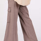 Wide leg knit terry mineral wash pants worn with a floral top and sandals