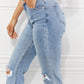 High Rise Distressed Slim Straight Jeans with pockets, light wash, slightly stretchy denim, and stylish knee rips.