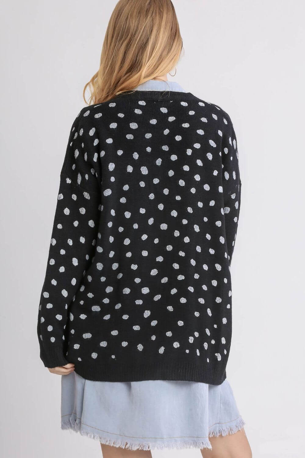 Back view of Umgee polka dot open front cardigan, featuring a stylish drop shoulder design in soft fabric.