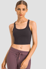 Sleek Millennia Racerback Sports Bra in black, offering comfort and style for yoga and fitness activities.