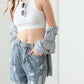 Fashion-forward model wearing Washed Barrel Leg High Waist Distressed Jeans with stylish destroyed detailing and chic white top.