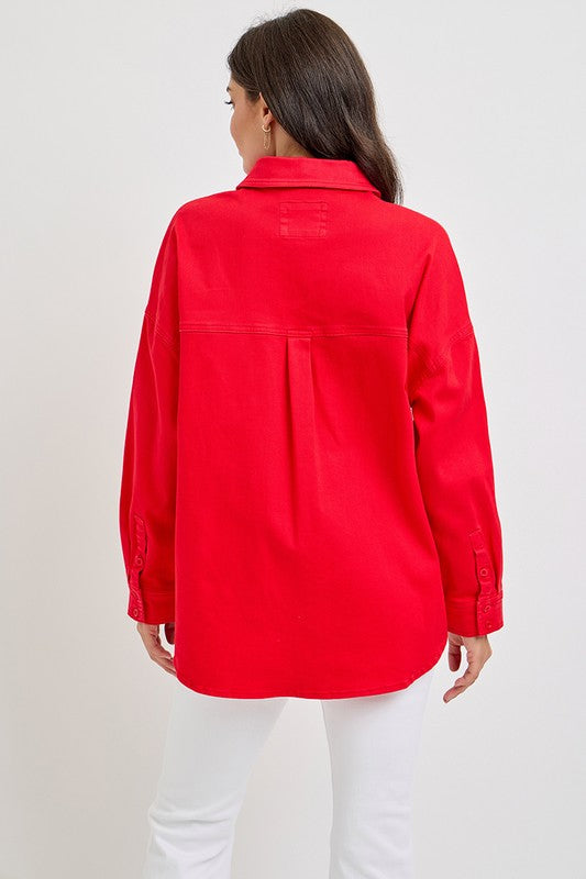 Back view of a woman wearing a red RISEN button-down long sleeve denim shacket, showcasing its stylish design and fit.