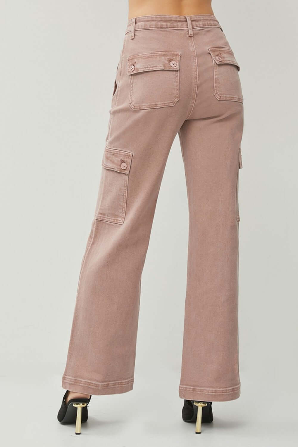 High rise wide leg cargo jeans with flap pockets, showcasing trendy style and functionality. Perfect for casual outings.