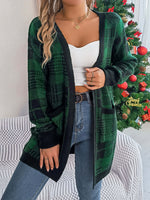 Woman wearing Bella Road Plaid Open Front Cardigan in front of a Christmas tree, showcasing cozy style and holiday fashion.