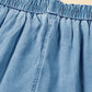 Close-up of the drawstring waistband on Bella Road denim wide leg jeans in light wash.