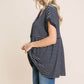 Woman wearing a Striped Button Front Baby Doll Top with blue jeans, showcasing the fitted bodice and lightly flared hem.