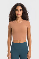 Millennia Round Neck Short Sleeve Cropped Sports T-Shirt in sandy color, perfect for yoga, featuring a stylish round neck.