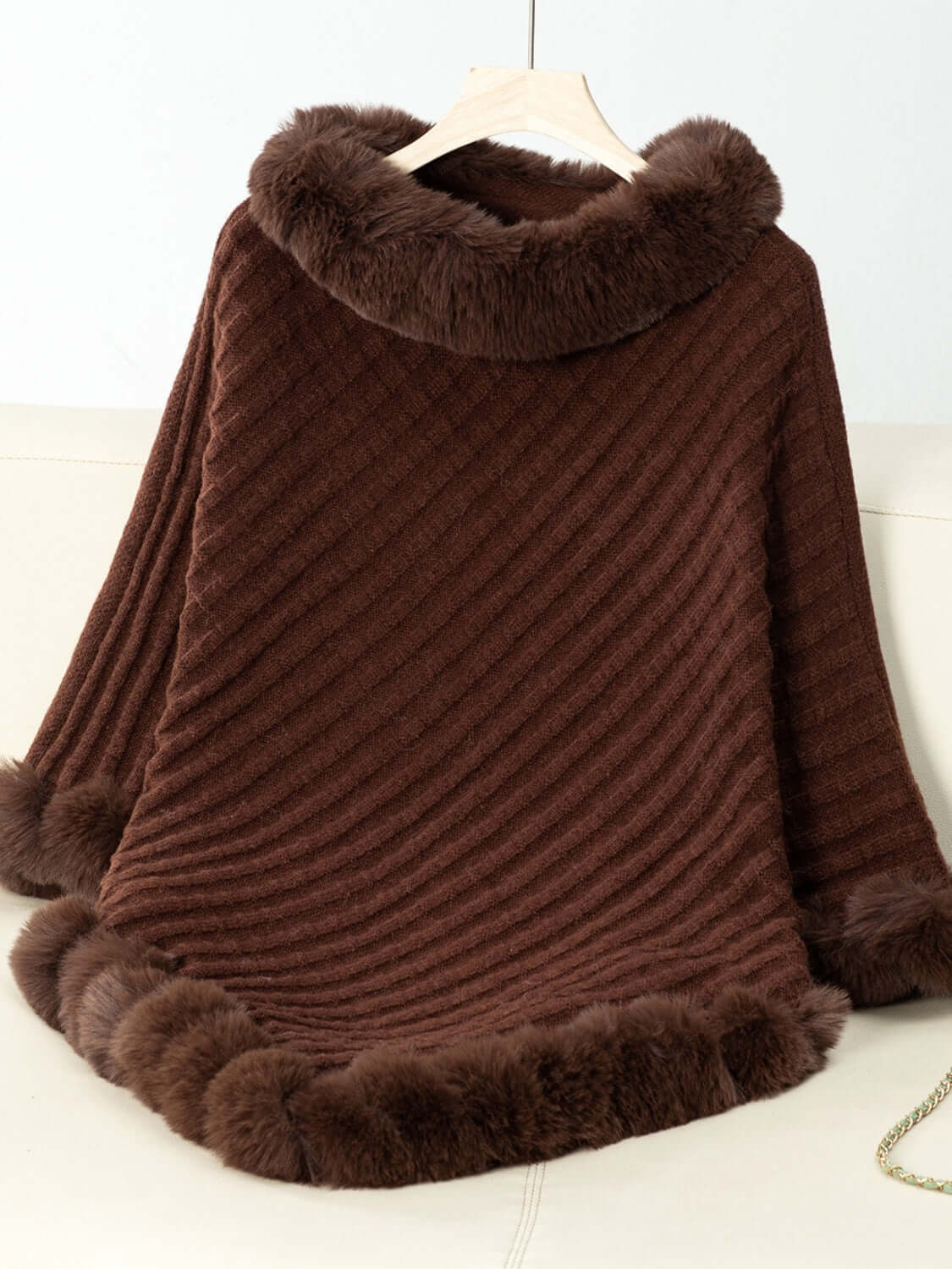 Stylish brown Bella Road poncho with fuzzy trim and textured design, perfect for cozy chilly days.