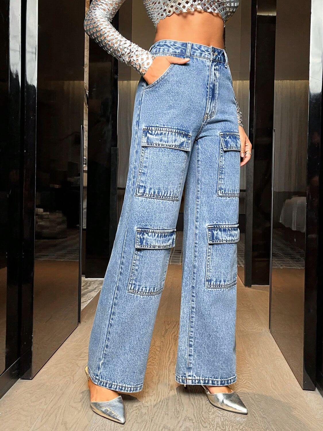 Woman wearing Bella Road Wide Leg High Waist Jeans with Pockets, featuring a stylish high-waist fit and spacious pockets in denim fabric