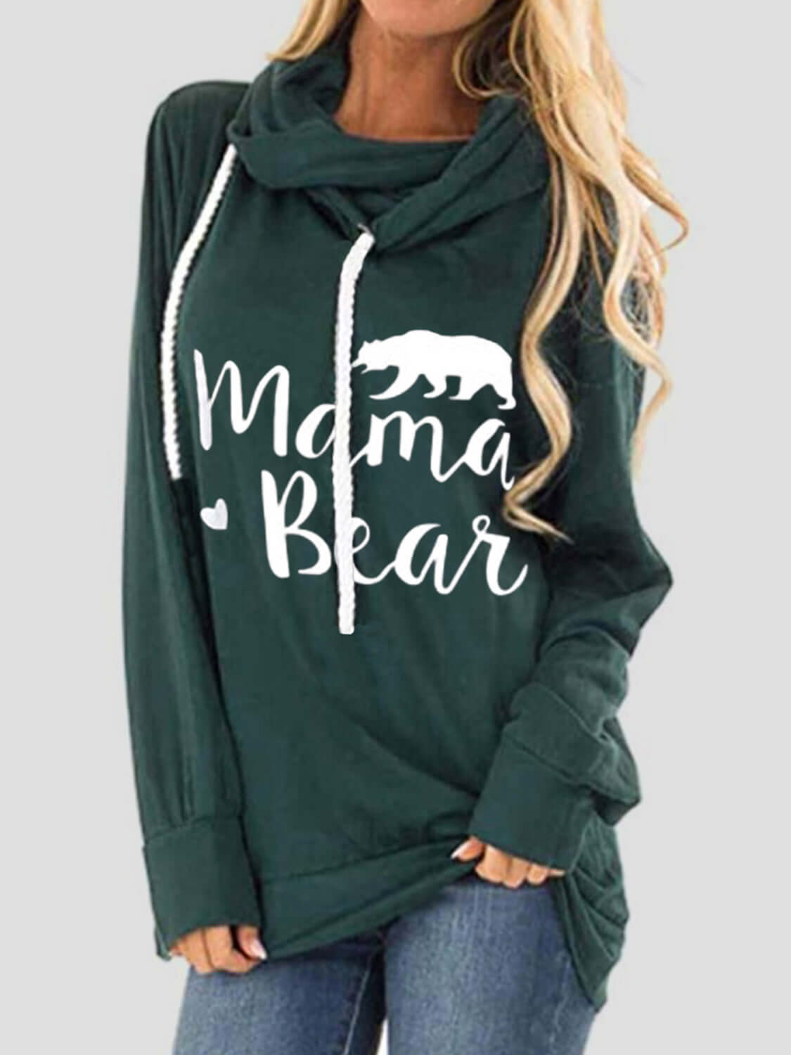 Woman wearing Bella Road green drawstring hoodie with "Mama Bear" graphic print, long sleeves, and slightly stretchy material.