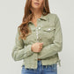 Trendy RISEN cropped denim jacket in soft green with raw hem and button-up design, perfect for plus-size fashion.