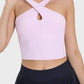 Millennia Crisscross Grecian Neck Active Cami in soft pink, featuring stylish crisscross design for workouts.