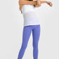 Stylish model in high waist ankle-length yoga leggings in vibrant purple, perfect for yoga and workouts.