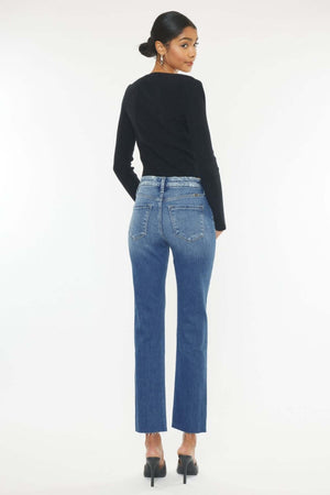 Woman modeling Kancan High Rise Wide Waistband Slim Straight Jeans, medium stone wash, frayed hem, perfect for casual and formal styles.