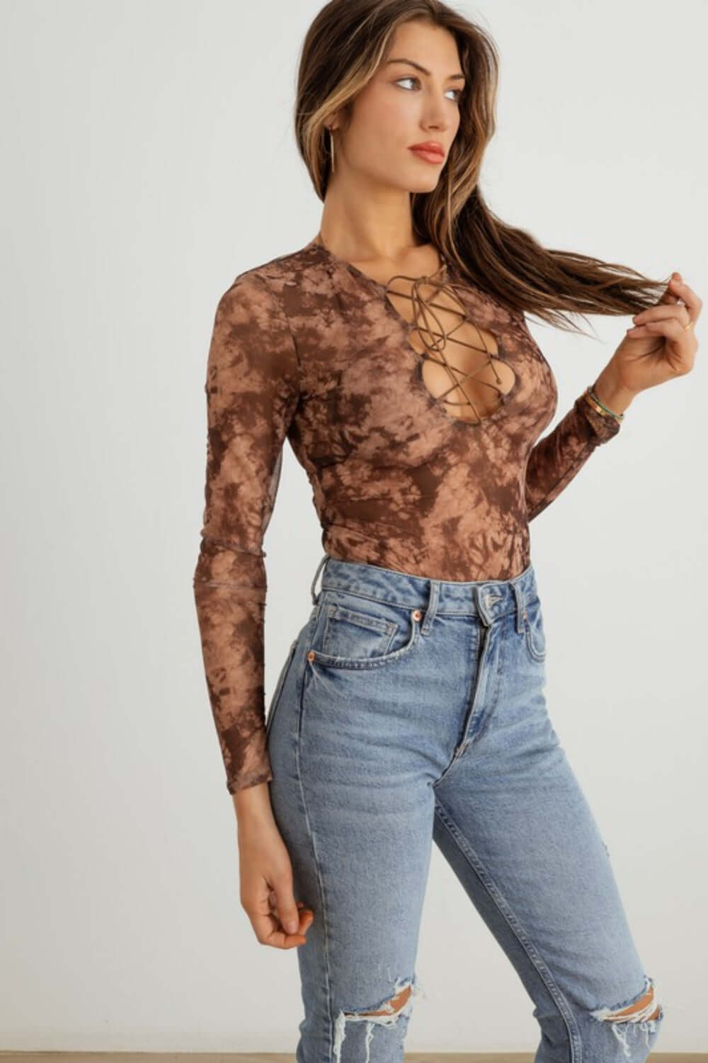 TASHA APPAREL Abstract Mesh Lace-Up Long Sleeve Bodysuit at Bella Road