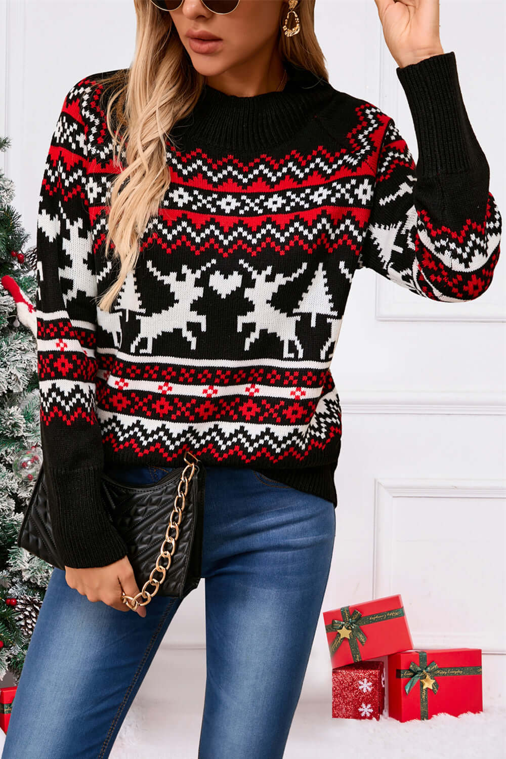 Woman wearing angel wings reindeer sweater with round neck, festive design, perfect for holiday cheer and cozy winter vibes.