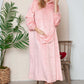 Cozy dusty pink hooded midi lounge dress with pockets, perfect for fall lounging and chilly days.