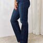 High-waisted button-fly straight Judy Blue jeans in dark wash, showcasing a flattering fit, slight stretch, and front pockets.