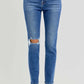 High rise ankle skinny jeans with knee distressing in blue denim featuring flattering fit and trendy cropped length.