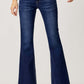 Woman wearing RISEN Full Size Low Rise Flare Jeans with retro vintage denim style and flattering silhouette.