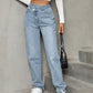 Woman wears Bella Road Asymmetric Waist Jeans with Pockets for stylish comfort, featuring plush lining and unique design.