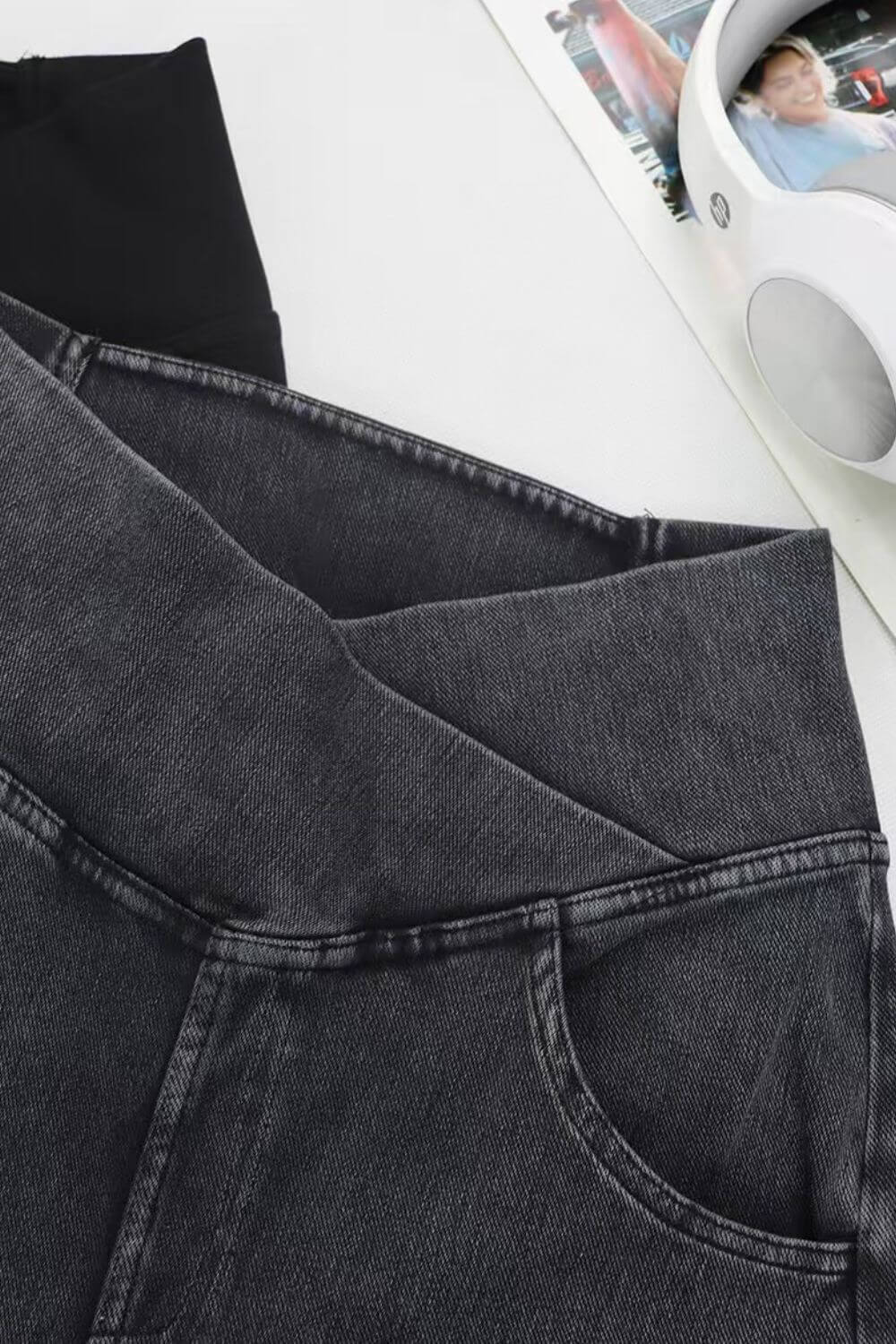 Close-up of Basic Bae Pocketed Highly Stretchy Bootcut Jeans showcasing the sleek waistband and pocket details.