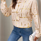 Woman wearing Perfee Printed Collared Neck Long Sleeve Shirt in tan with gold accents, paired with jeans and holding a white purse.