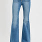 Retro-inspired RISEN full size flare jeans with front patch pockets and stylish flared leg design.