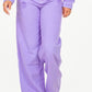 Fashionable high waist distressed wide leg jeans in vibrant purple for a trendy look.