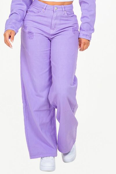 Fashionable high waist distressed wide leg jeans in vibrant purple for a trendy look.