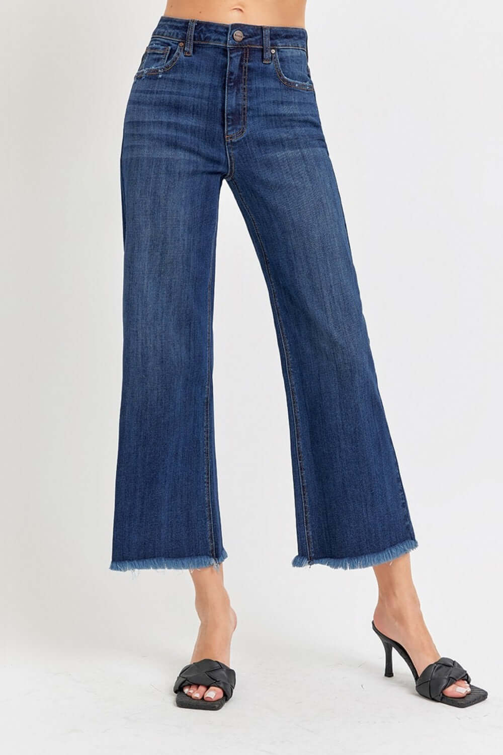 High Rise Raw Hem Cropped Wide Leg Risen Jeans styled with black heels for a chic look