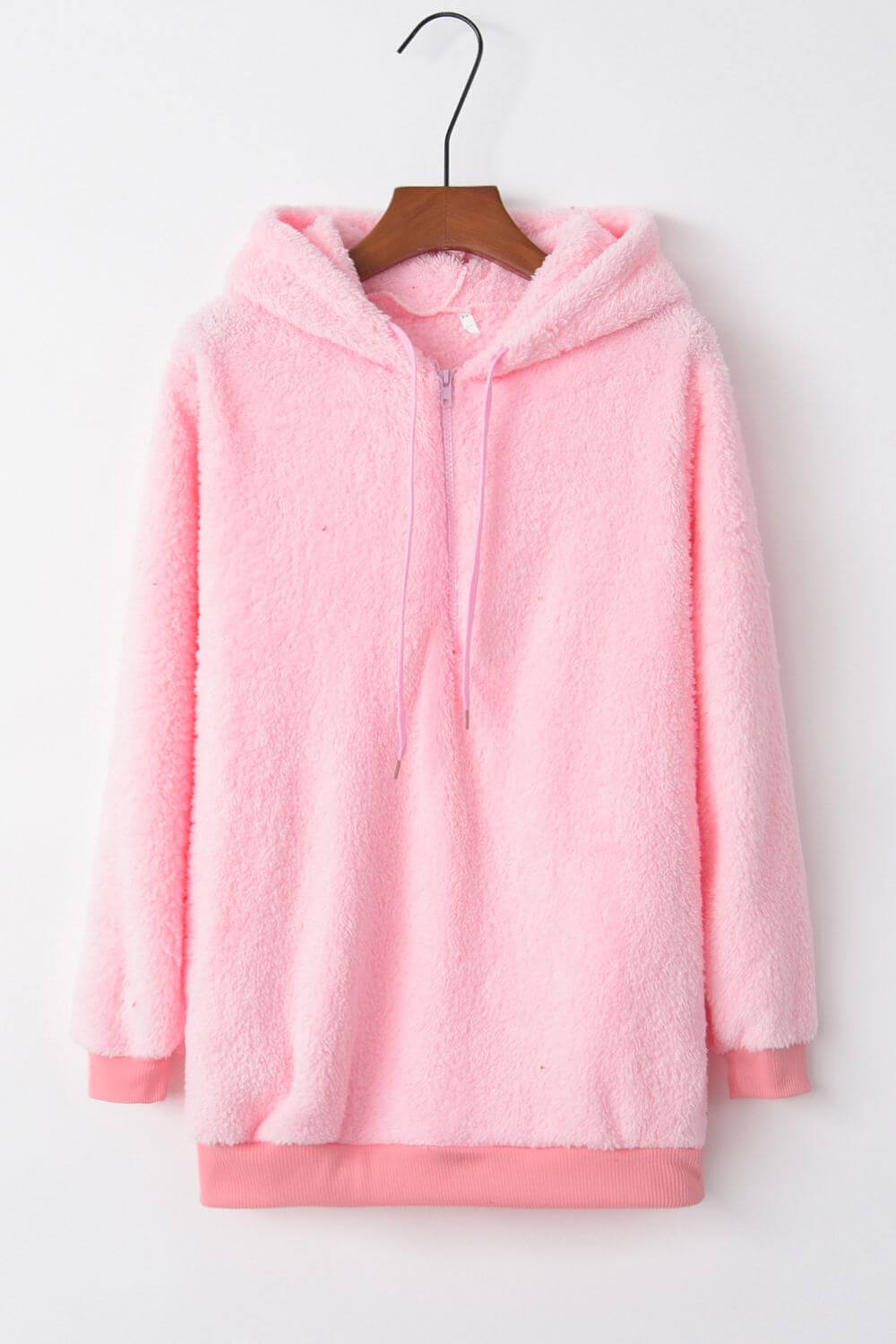 Soft pink teddy hoodie featuring a quarter-zip and cozy drawstring, perfect for chilly days and casual outings.