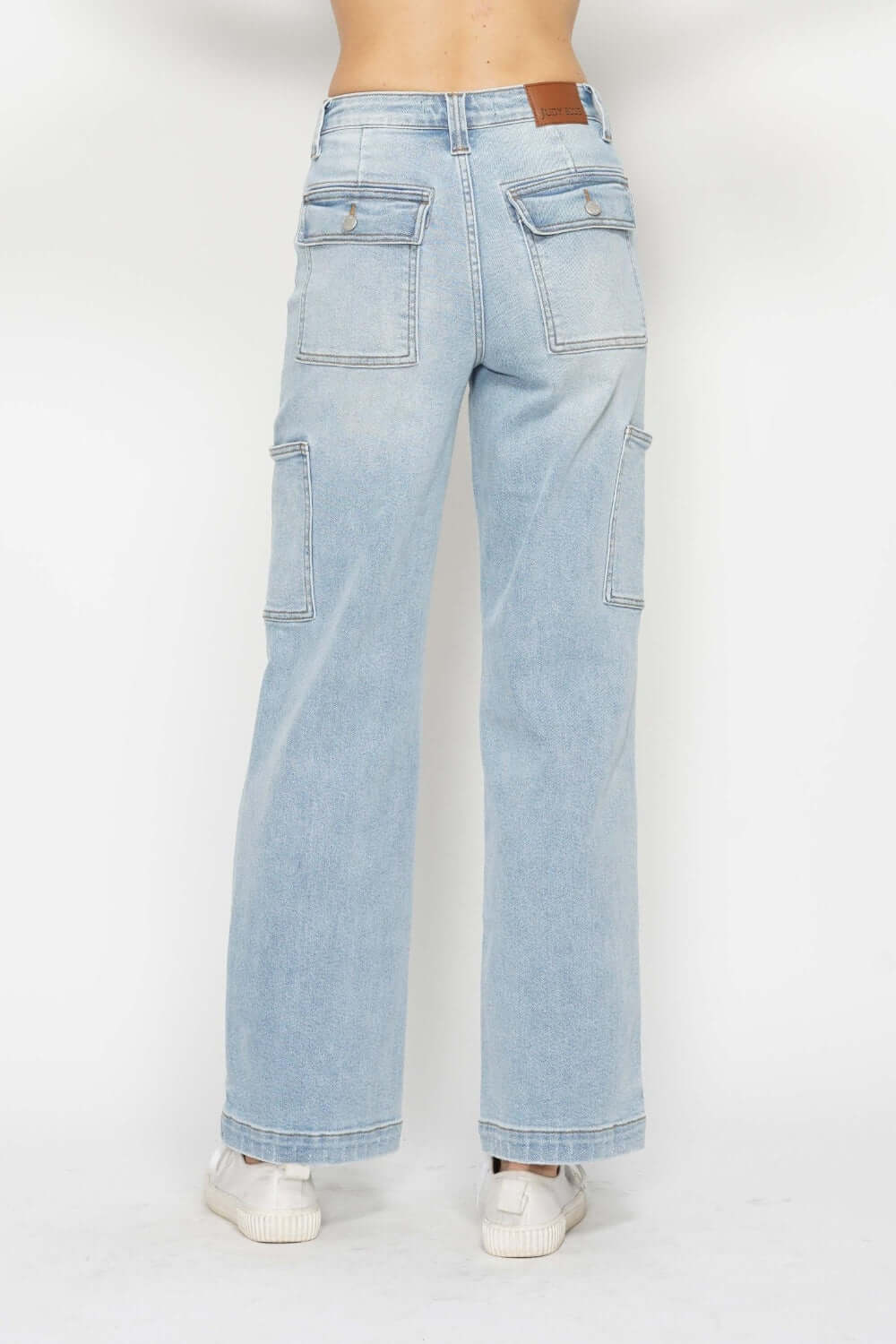 Back view of high waist straight cargo jeans with multiple pockets by Judy Blue Jeans. Trendy, practical, and versatile denim pants.