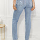 High Rise Distressed Slim Straight Jeans with Slight Stretch and Light Wash, Rear View