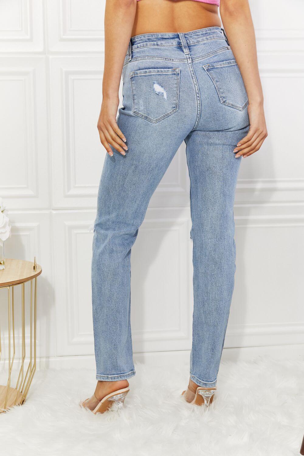 High Rise Distressed Slim Straight Jeans with Slight Stretch and Light Wash, Rear View