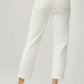 Woman wearing RISEN Full Size High Waist Rolled Hem Straight Jeans in white, showcasing back view with rolled hems and high waist design.