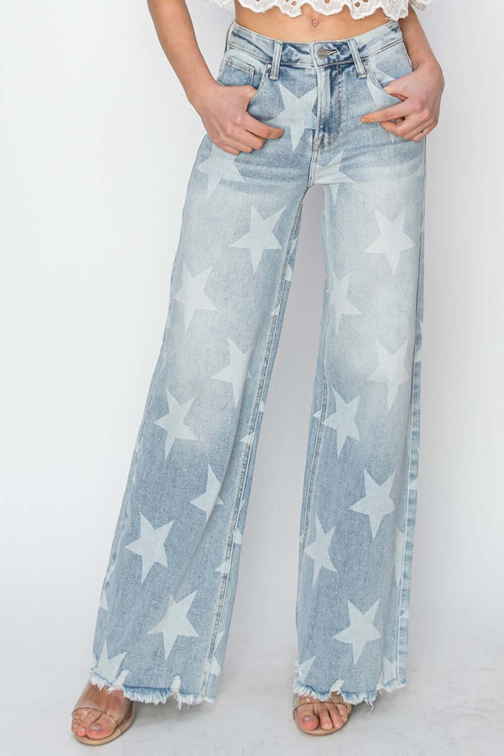 Fashionable Risen Jeans with raw hem and star embellishments in a wide leg silhouette, perfect for a casual and edgy look.