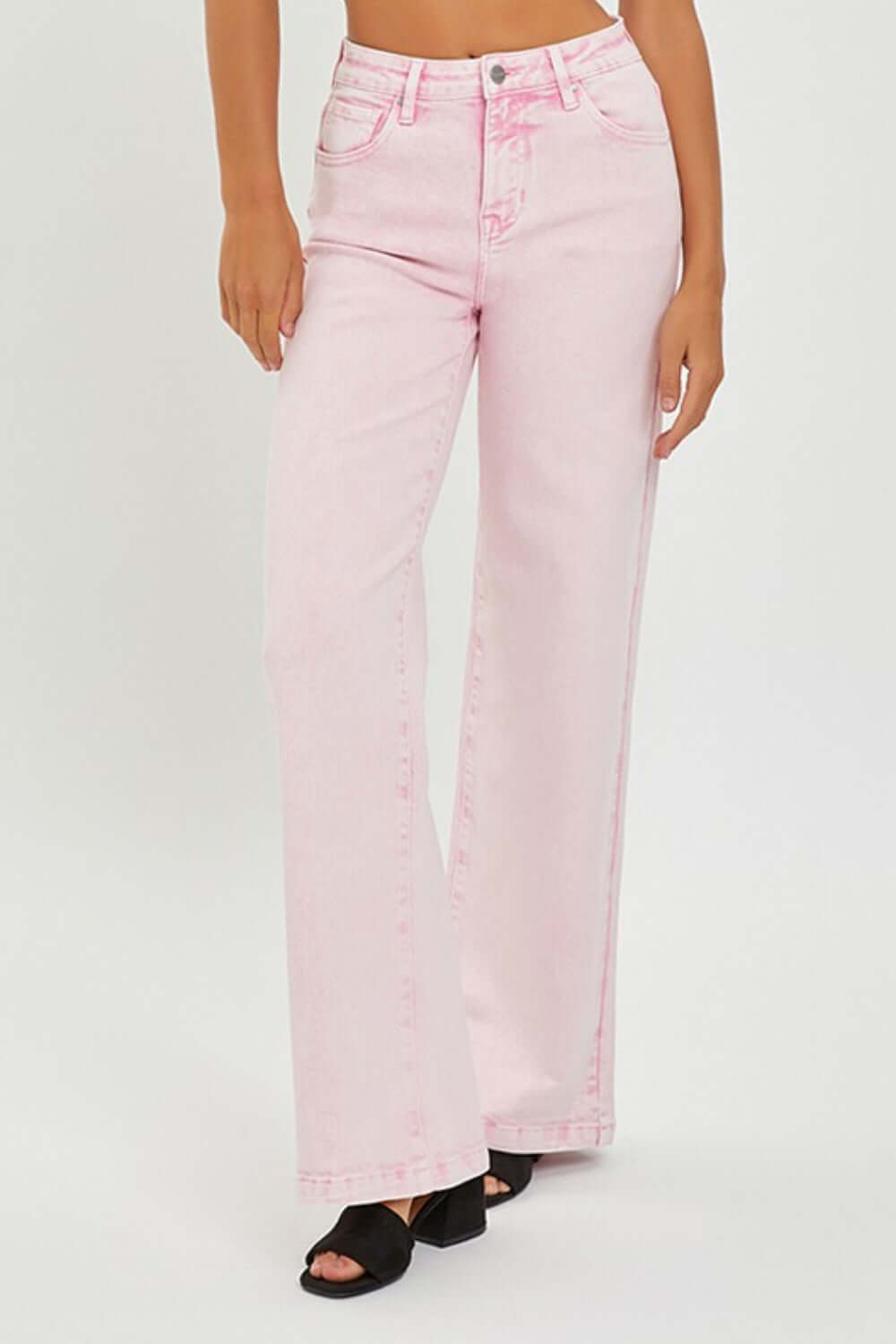 Stylish high rise tummy control pink wide leg jeans from Risen Jeans, offering retro flair and midsection slimming for a chic look