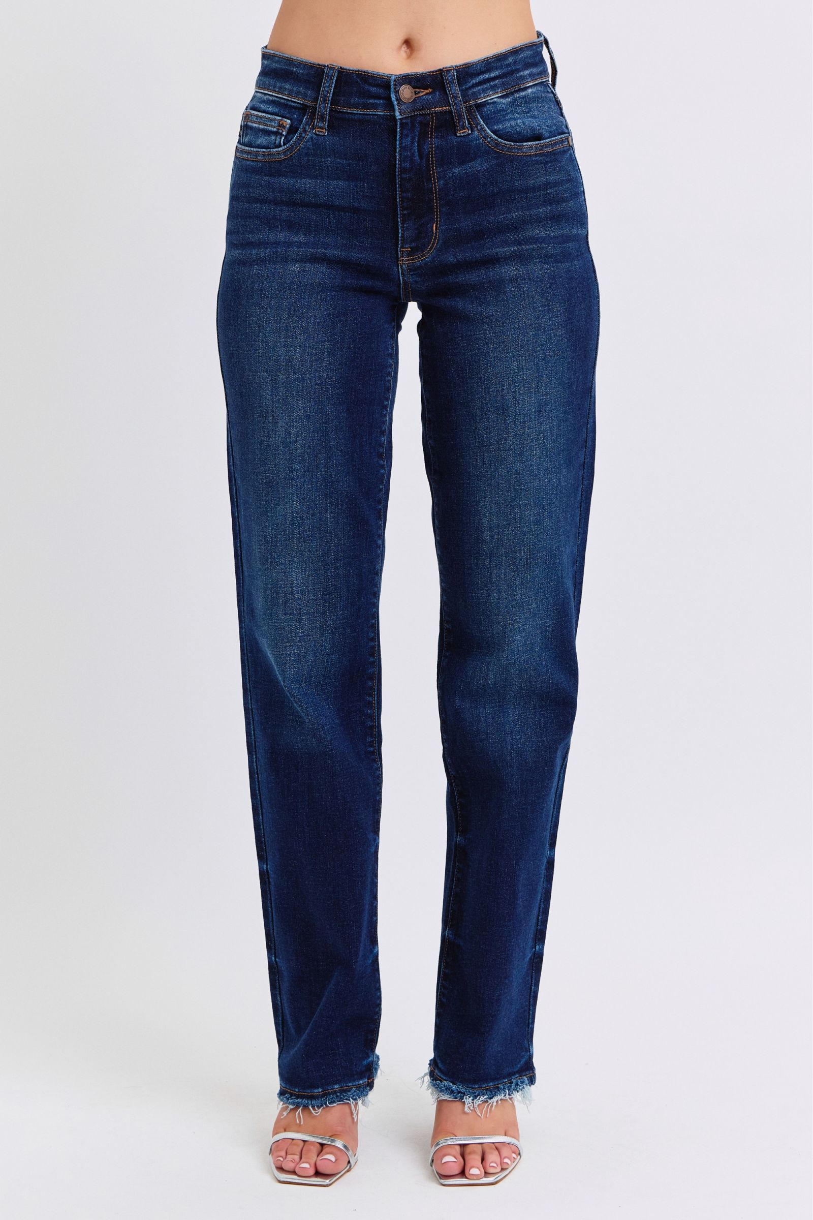 Judy Blue raw hem straight leg jeans with a timeless style and edgy finish. Perfect for casual or dressy outfits. Style #82622.