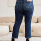 Back view of woman wearing RFM Jeans Crop Dylan Full Size Tummy Control Distressed High Waist Raw Hem Jeans with black heels