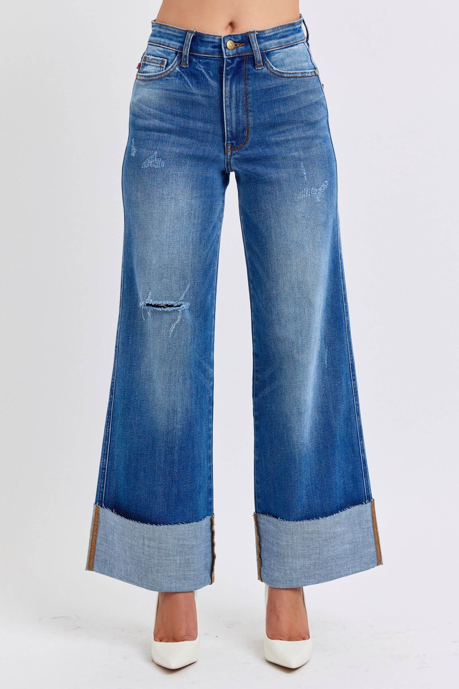 Judy Blue distressed high waist wide leg jeans showcasing a trendy, relaxed fit and stylish cuff details. Perfect for casual outfits!