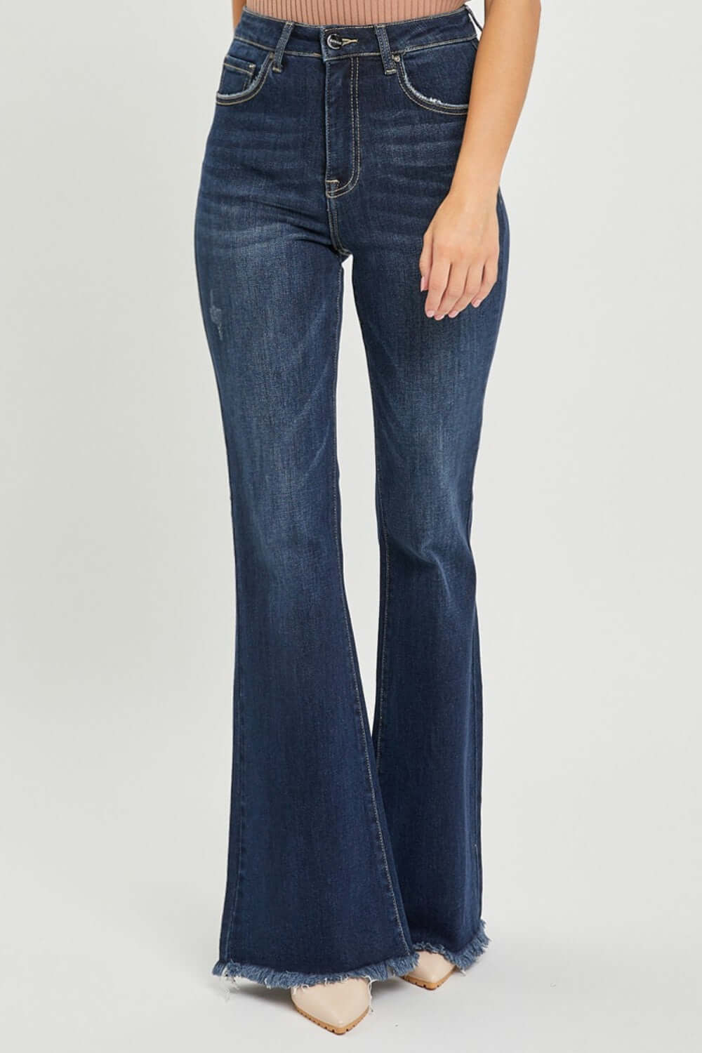 Chic Risen Jeans High Waist Raw Hem Flare Jeans showcasing a flattering high-rise waist and edgy raw hem. Ideal for a trendy retro-inspired look.