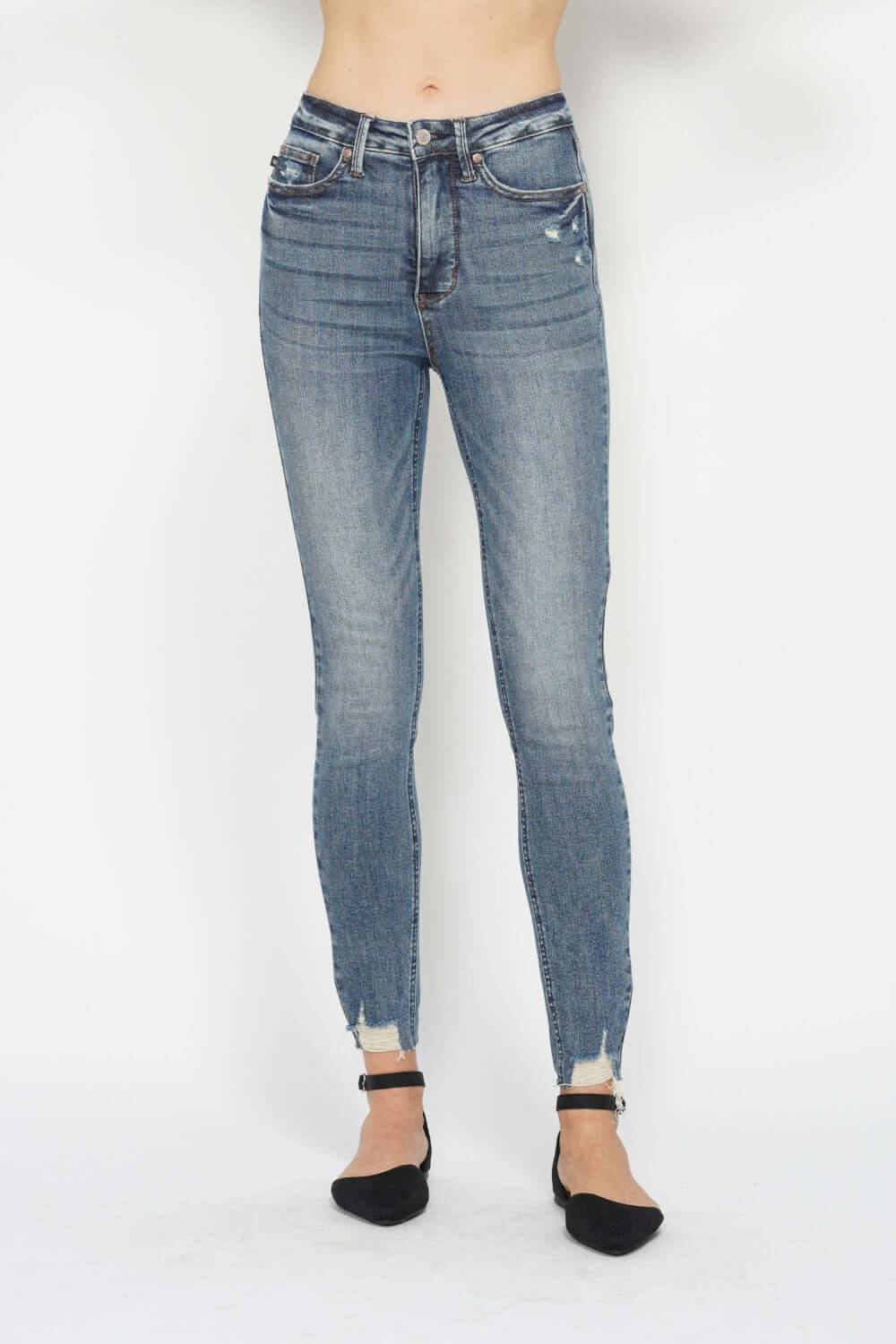 Tummy Control Vintage Wash Hem Destroy Skinny Jeans by Judy Blue showing front view with distressed hem detailing.