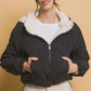 Woman wearing Love Tree Zip Up Cropped Hooded Sherpa Reversible Jacket, showcasing its stylish reversible design and cozy fit.