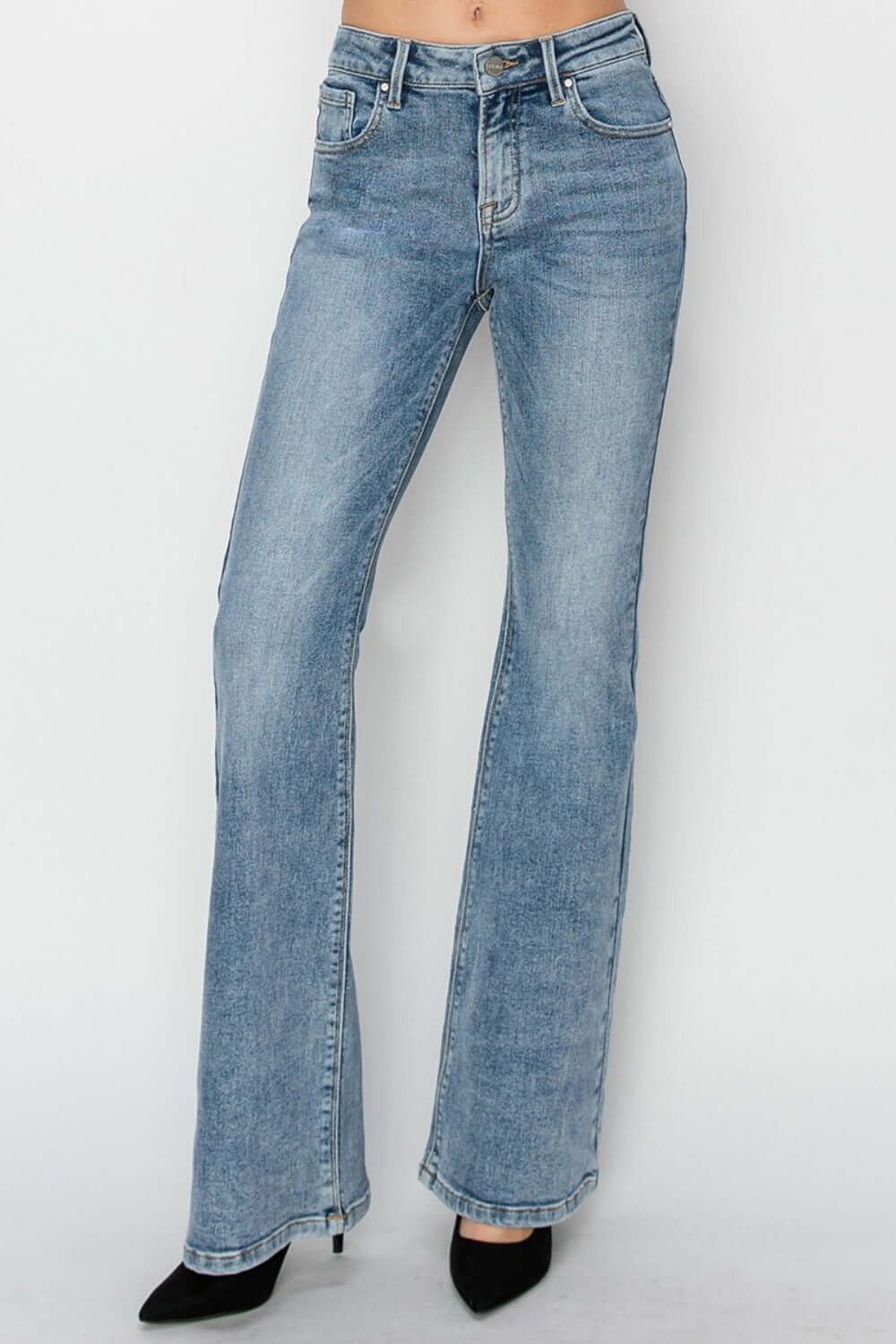 Mid-rise bootcut jeans by Risen Jeans featuring a flattering silhouette, perfect for pairing with heels or boots for any occasion.