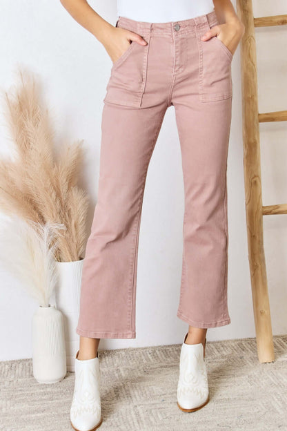 Risen Jeans high-rise ankle flare jeans in blush pink, featuring slightly stretchy fabric and pocketed design. Perfect for modern style and versatility.