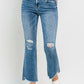 Mid Rise Distressed Cropped Flare Jeans with stylish ripped details and a vintage-inspired cropped flare leg.