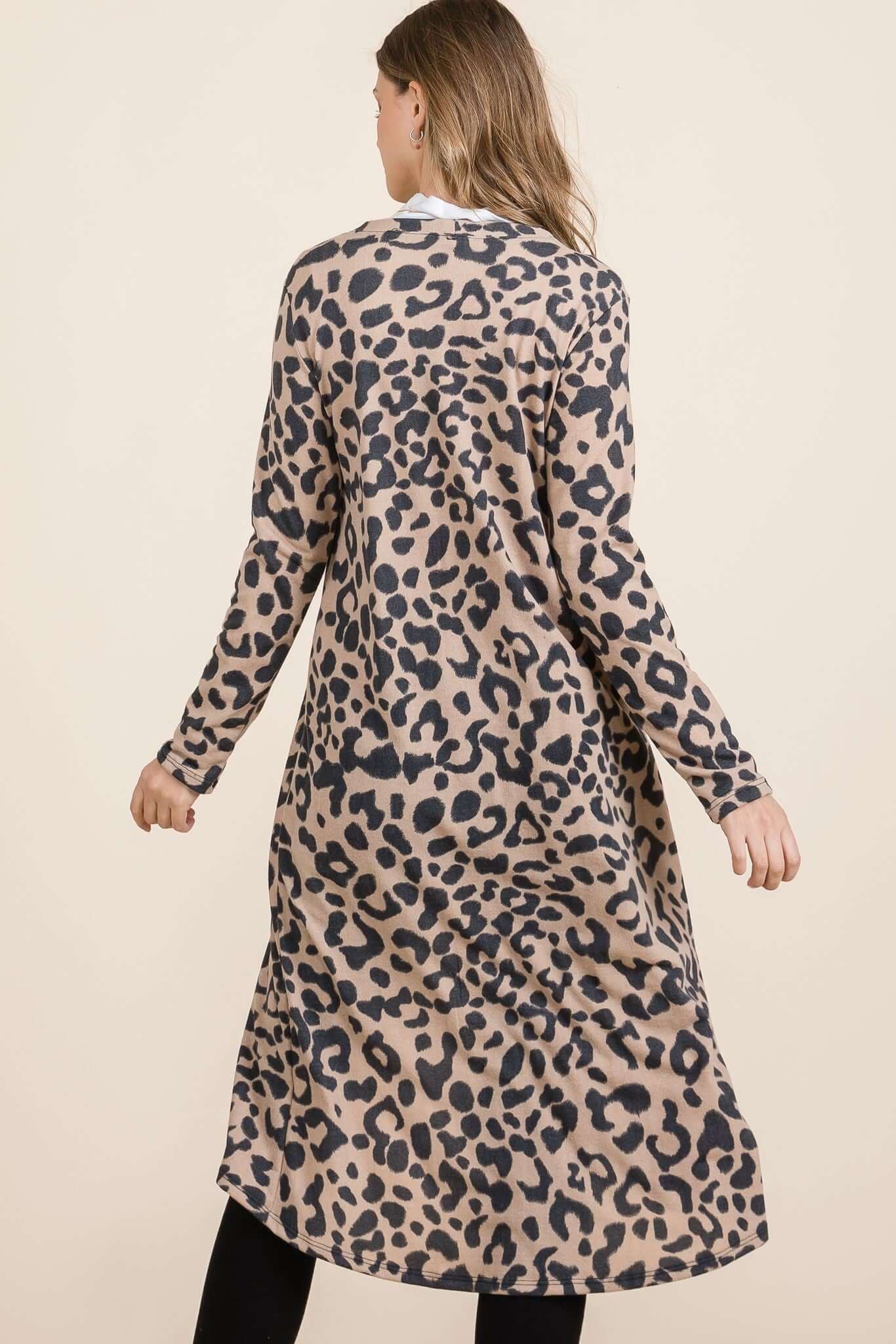 Model showcasing the Celeste Leopard V-Neck Long Sleeve Cardigan from the back, highlighting its wild print and cozy fit.